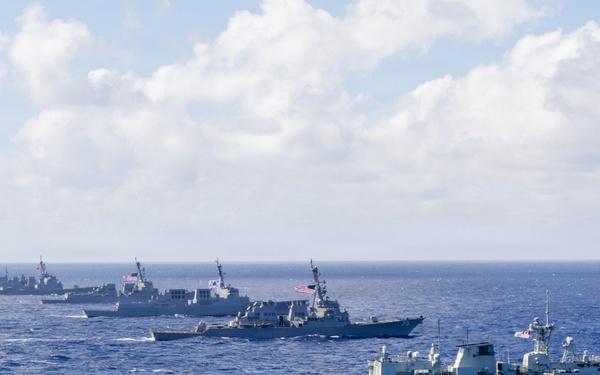 Multinational ships sail in formation during RIMPAC 2026