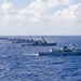 Multinational ships sail in formation during RIMPAC 2026