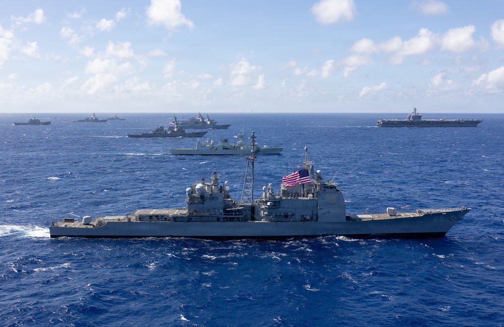 Multinational ships sail in formation during RIMPAC 2026