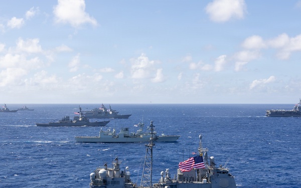 Multinational ships sail in formation during RIMPAC 2026