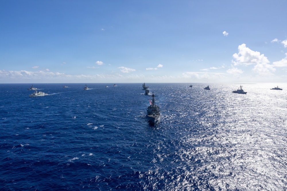 Multinational ships sail in formation during RIMPAC 2026