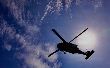 U.S. Army and Malaysian troops coordinate a simulated air-to-ground assault