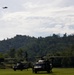 U.S. Army and Malaysian troops coordinate a simulated air-to-ground assault