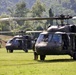 U.S. Army and Malaysian troops coordinate a simulated air-to-ground assault