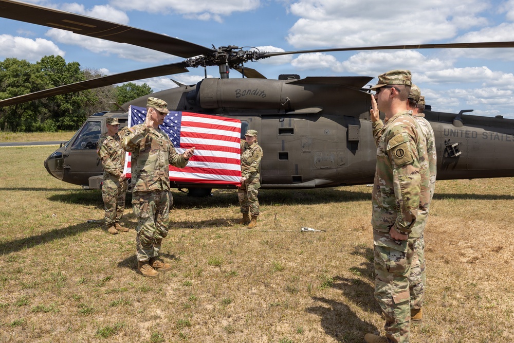 Soldiers Reenlist in Front of Black Hawk