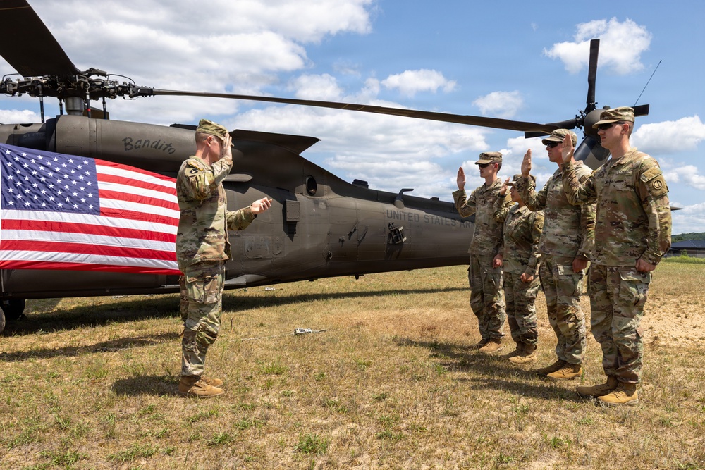 Soldiers Reenlist in Front of Black Hawk