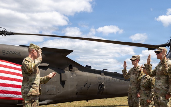 Soldiers Reenlist in Front of Black Hawk