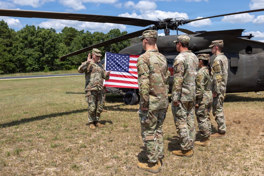 Soldiers Reenlist in Front of Black Hawk