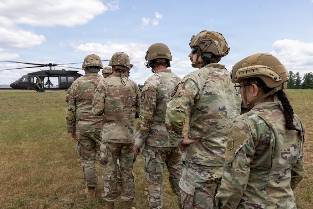 Soldiers wait to Board Black Hawk