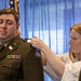 U.S. Army Lt. Col. Travis Moore promotes Capt. Matthew Standridge to the rank of major