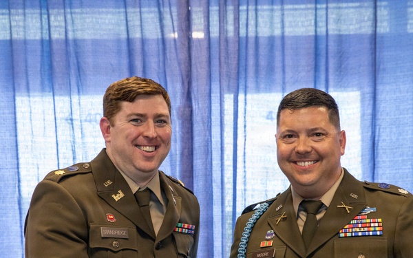U.S. Army Lt. Col. Travis Moore promotes Capt. Matthew Standridge to the rank of major