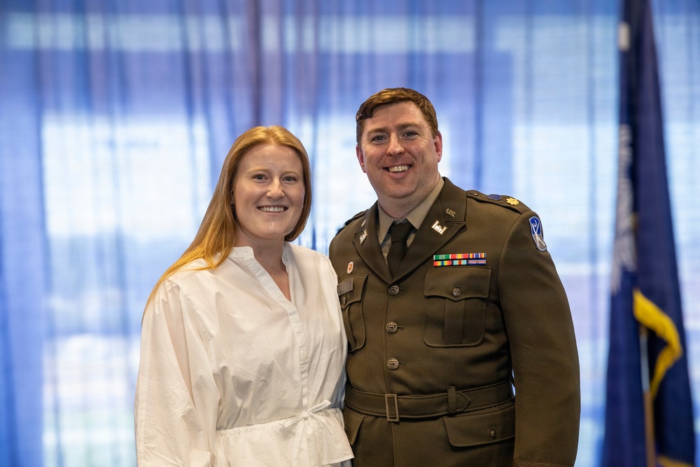 U.S. Army Lt. Col. Travis Moore promotes Capt. Matthew Standridge to the rank of major