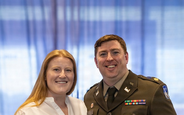 U.S. Army Lt. Col. Travis Moore promotes Capt. Matthew Standridge to the rank of major