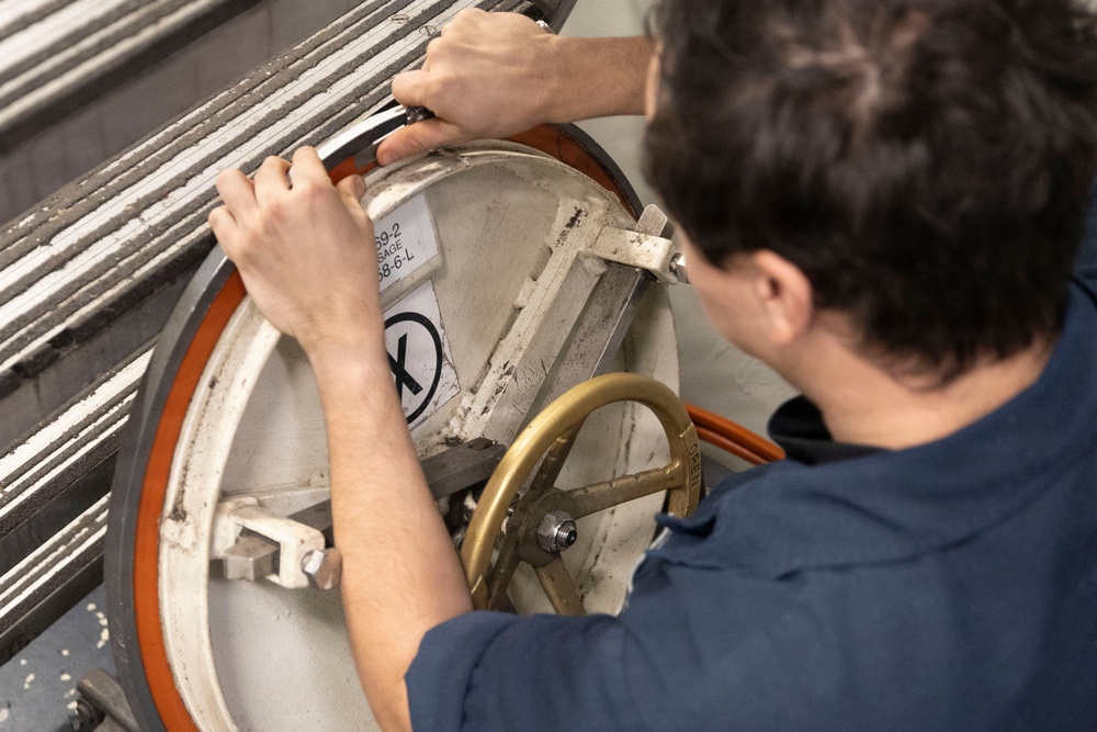 Michael Murphy Sailor Performs Hatch Maintenance