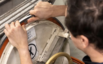 Michael Murphy Sailor Performs Hatch Maintenance