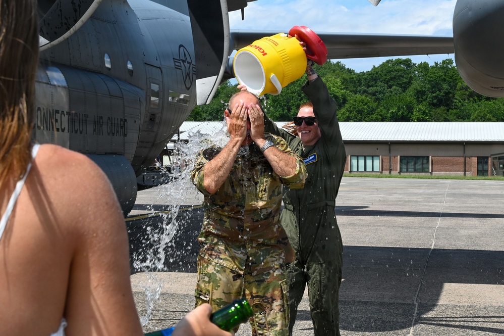 103rd Airlift Wing celebrates Col. Paul Fiasconaro’s final flight