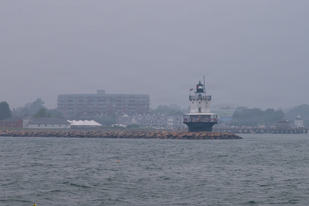 USCGC Eagle passes lighthouse in Portland, Maine