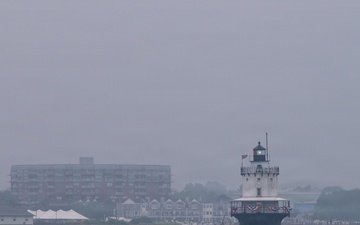 USCGC Eagle passes lighthouse in Portland, Maine