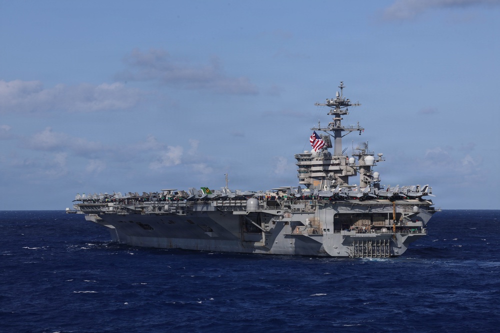 USS Theodore Roosevelt leads formation of ships during RIMPAC 26