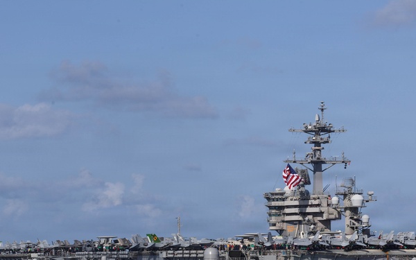 USS Theodore Roosevelt leads formation of ships during RIMPAC 26