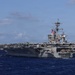 USS Theodore Roosevelt leads formation of ships during RIMPAC 26
