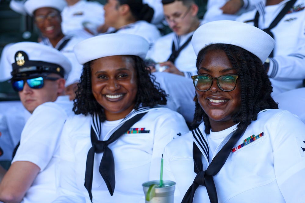 U.S. Navy Sailors attend a Seattle Mariners baseball game during Seattle Seafair Fleet Week
