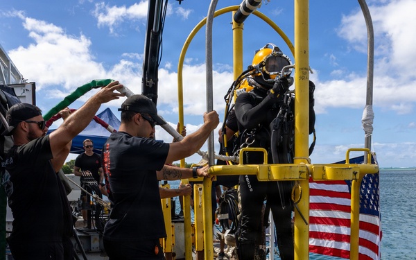 U.S. Navy Divers prepare to enter water for salvage dive during RIMPAC 2026
