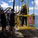 U.S. Navy Divers prepare to enter water for salvage dive during RIMPAC 2026