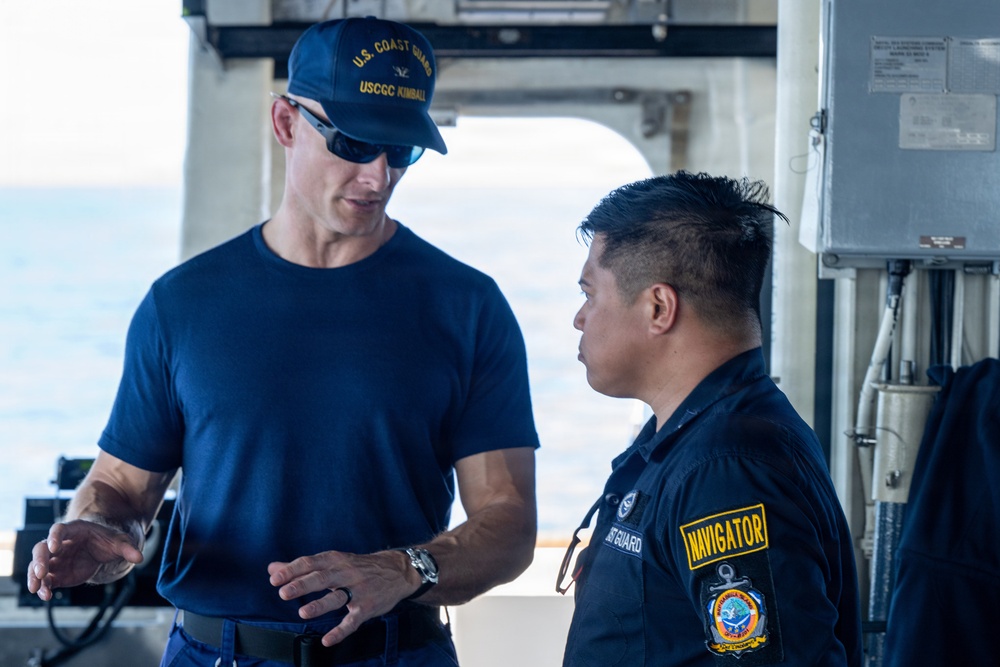 U.S. Coast Guard commanding officer talks with Philippine coast guardsman