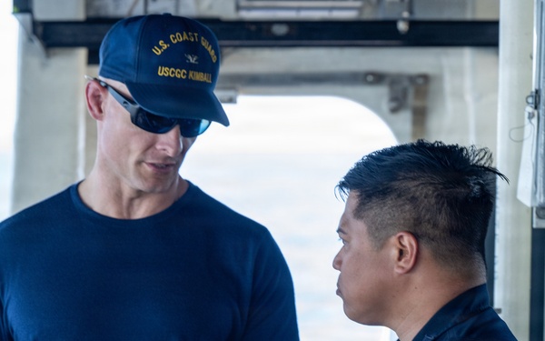 U.S. Coast Guard commanding officer talks with Philippine coast guardsman