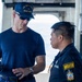 U.S. Coast Guard commanding officer talks with Philippine coast guardsman
