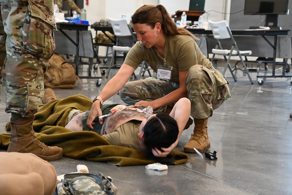 Military Medical Personnel Practice Tactical Combat Casualty Care During Training Exercise