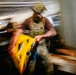 Navy Divers and EOD Technicians Conduct a Shipboard Response Drill