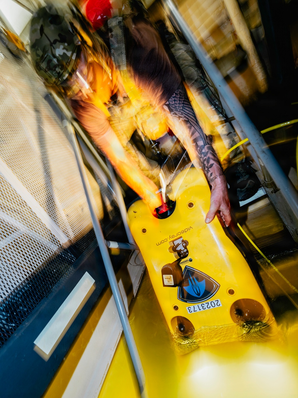 Navy Divers and EOD Technicians Conduct a Shipboard Response Drill