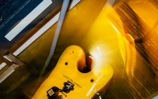Navy Divers and EOD Technicians Conduct a Shipboard Response Drill