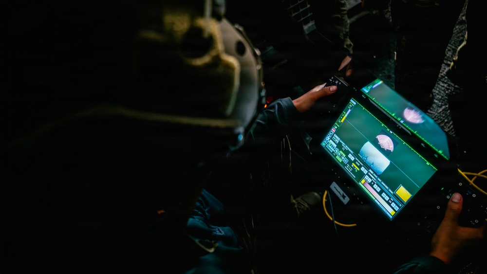 Navy Divers and EOD Technicians Conduct a Shipboard Response Drill