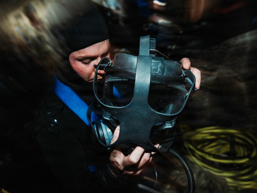 Navy Divers and EOD Technicians Conduct a Shipboard Response Drill