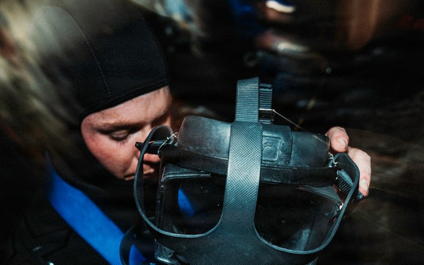 Navy Divers and EOD Technicians Conduct a Shipboard Response Drill