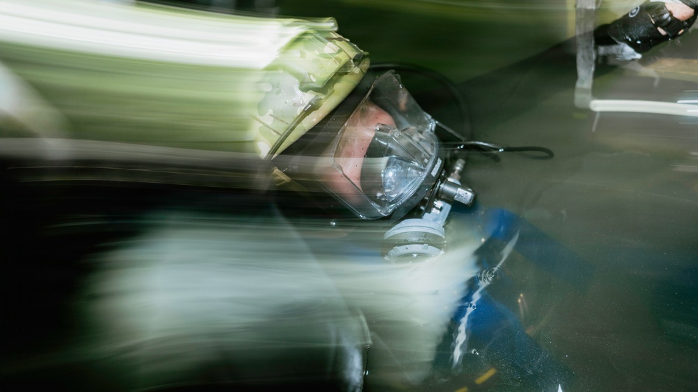 Navy Divers and EOD Technicians Conduct a Shipboard Response Drill