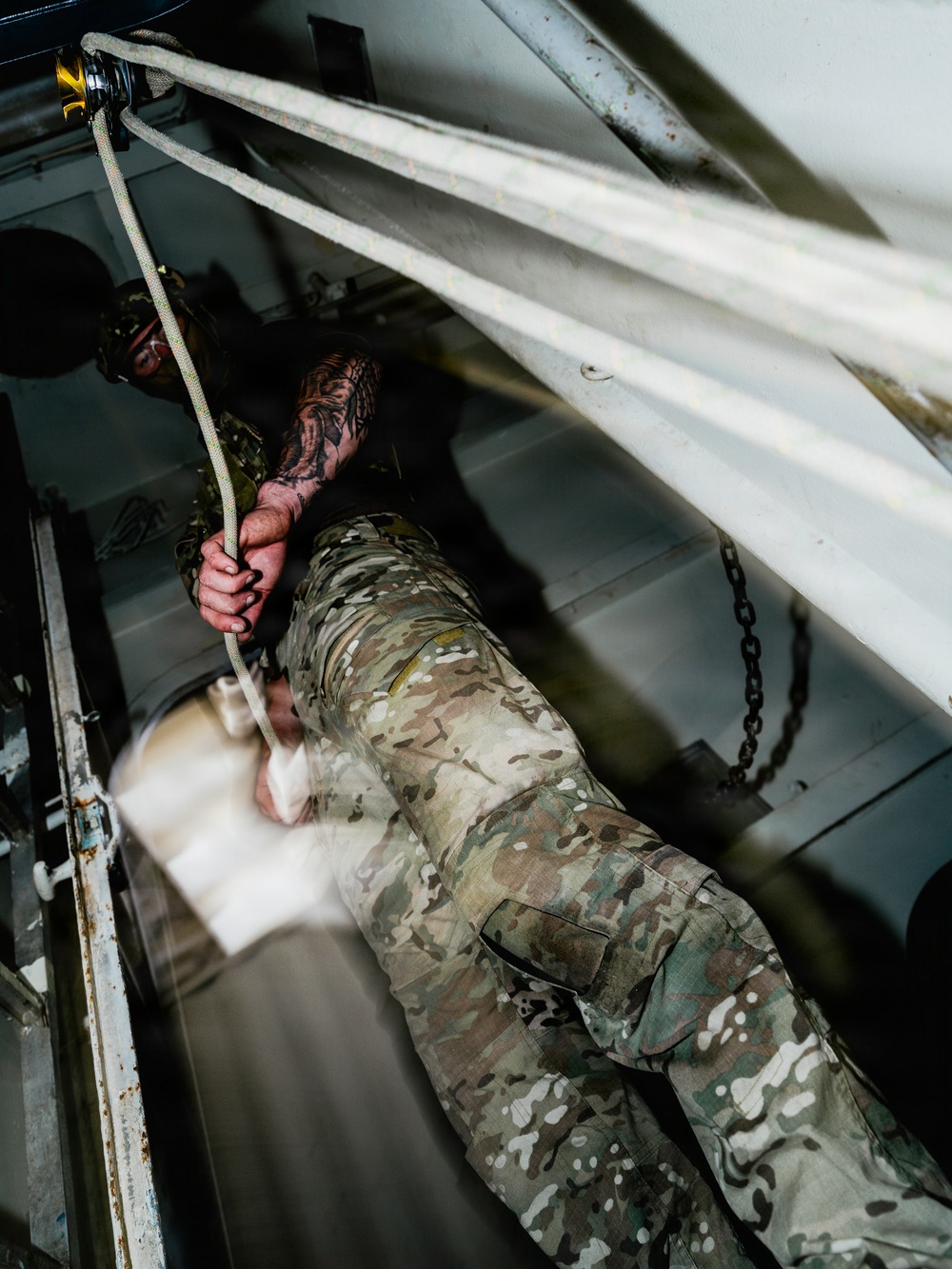 Navy Divers and EOD Technicians Conduct a Shipboard Response Drill