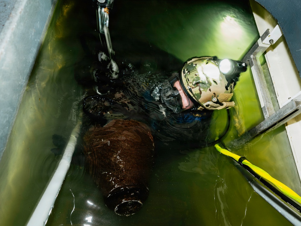 Navy Divers and EOD Technicians Conduct a Shipboard Response Drill