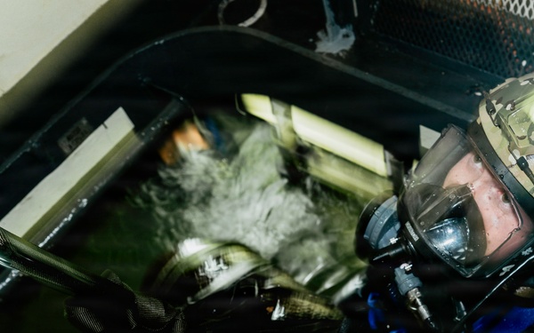 Navy Divers and EOD Technicians Conduct a Shipboard Response Drill