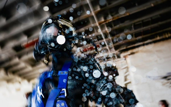 Navy Divers and EOD Technicians Conduct a Shipboard Response Drill
