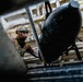 Navy Divers and EOD Technicians Conduct a Shipboard Response Drill
