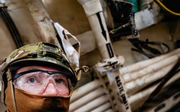 Navy Divers and EOD Technicians Conduct a Shipboard Response Drill