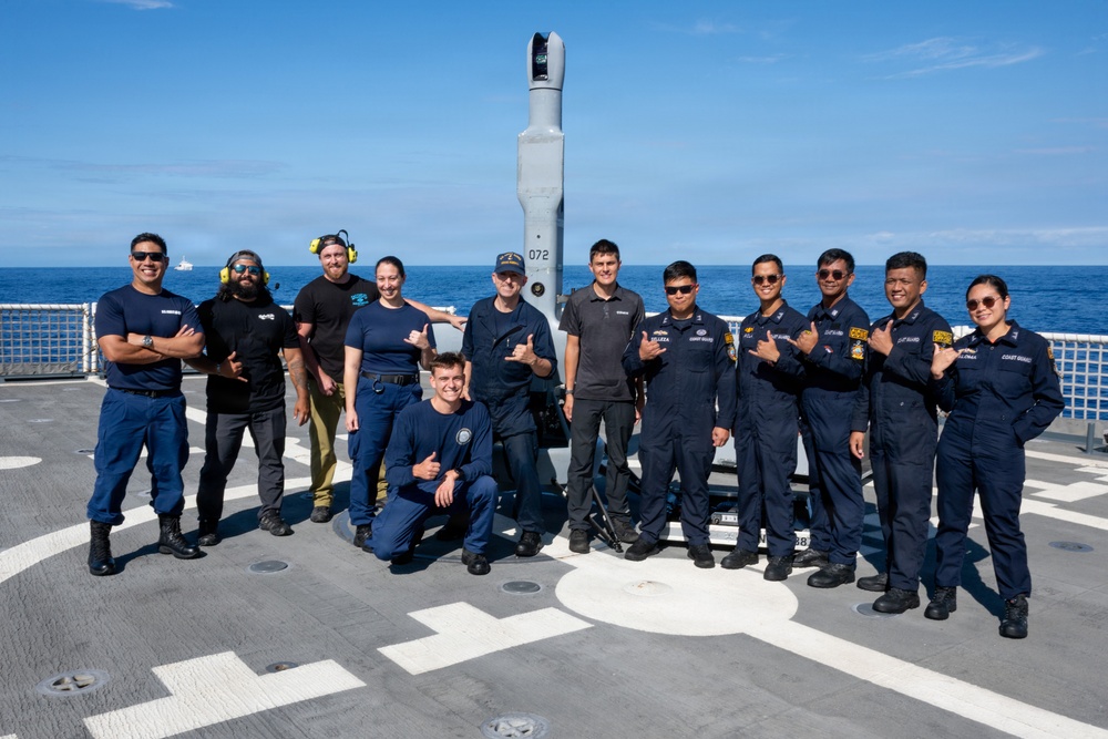 U.S. and Philippine Coast Guard stand in front of V-BAT drone