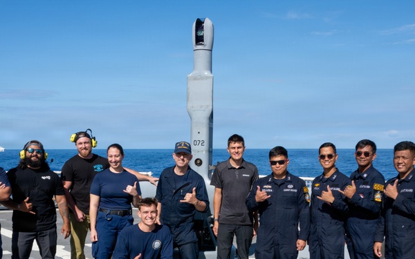 U.S. and Philippine Coast Guard stand in front of V-BAT drone