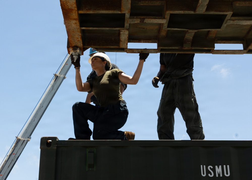 USS Rushmore ports and off-loads equipment