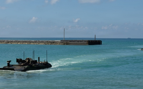 USS Rushmore ports and off-loads equipment