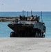 USS Rushmore ports and off-loads troops and equipment